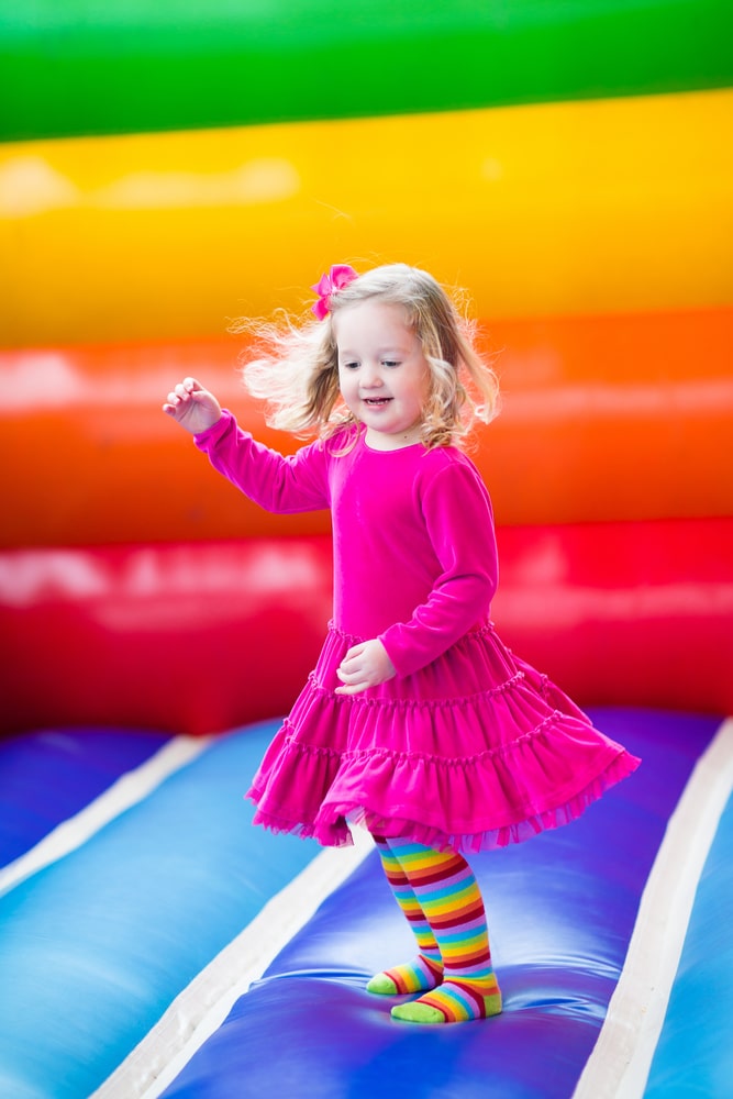 Little girl jumping and bouncing